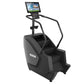 Black Precor stair climber with integrated handrails, digital console display, and control panel on white background