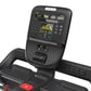Precor TRM 500 Line black treadmill with digital display console showing workout metrics and yellow graph display on white ba
