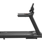 Black motorized treadmill with digital display console and adjustable handrail, shown from side angle on white background
