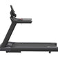 Black motorized treadmill with upright console, handrails, and wide running deck on white background
