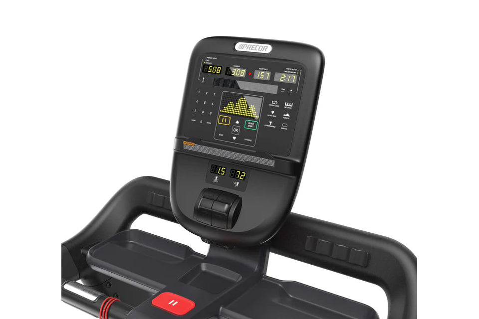 Black Precor TRM 531 treadmill with digital display console showing metrics, control buttons, and red emergency stop clip on 