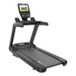 Black commercial treadmill with digital touchscreen console displaying workout metrics, on white background