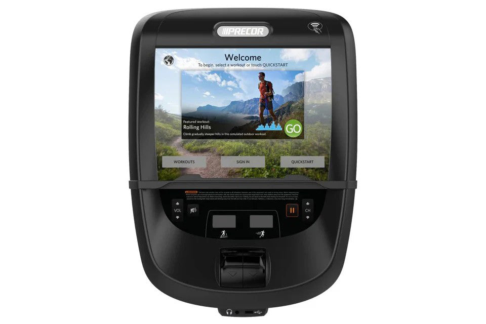 Black Precor treadmill with touchscreen display showing welcome interface and outdoor hiking workout, control buttons below s