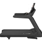 Black commercial treadmill with cushioned deck, dual handrails, and digital console display on white background
