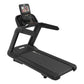 Black commercial treadmill with digital display console showing workout metrics, cushioned running deck, and stationary handr