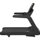 Black commercial treadmill with curved frame, digital console display, and textured running belt on white background