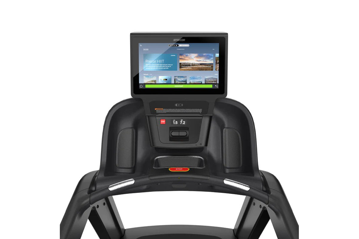 Black Precor treadmill with touchscreen console displaying fitness interface, green progress bar, and digital readout showing
