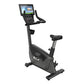 Black upright exercise bike with digital console display, padded seat, handlebars, and stabilizing base on white background