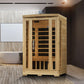 Natural cedar wood sauna cabin with glass front door and black interior benches, shown in spa bathroom setting