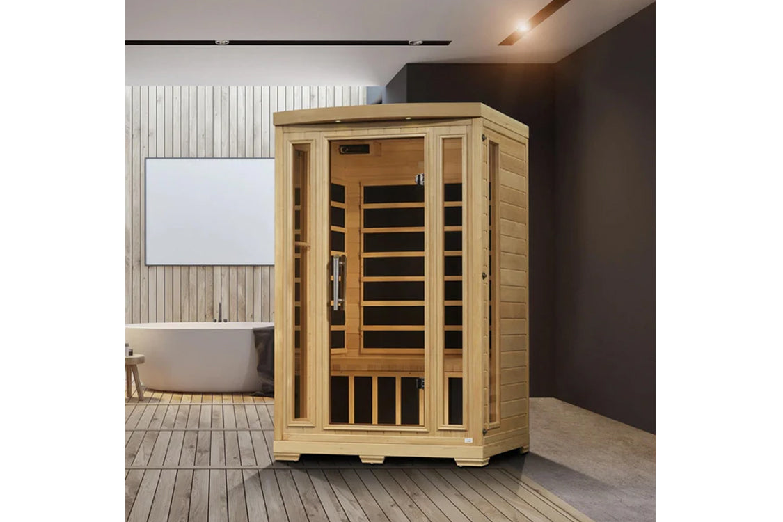 Natural wood 2-person infrared sauna with glass front door and black interior benches, displayed in modern bathroom setting