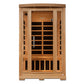 Wooden sauna cabin with glass door, infrared heating panels visible inside, natural cedar construction on white background