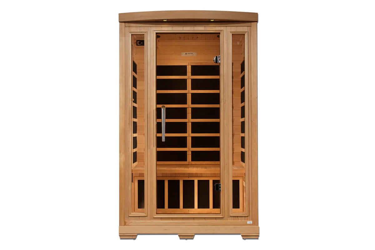 Wooden sauna cabin with glass door, infrared heating panels visible inside, natural cedar construction on white background
