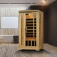 Natural wood infrared sauna cabin with glass door and black interior panels, displayed in modern bathroom setting