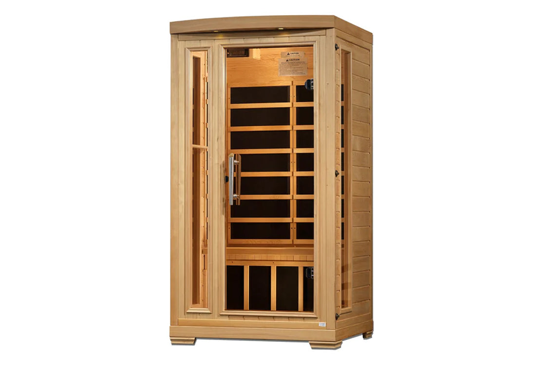 Natural wood far infrared sauna with glass door, wooden bench seating, and black heating panels visible inside on white backg