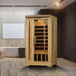 Natural wood infrared sauna cabin with glass door and wooden bench interior, displayed in modern bathroom setting