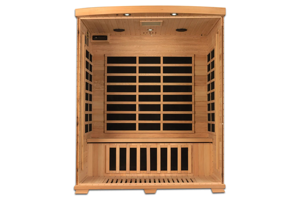 Cedar wood infrared sauna with black interior heater panels, open door view showing bench seating and ceiling lights on white