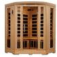 Natural wood corner infrared sauna with glass doors, wooden benches, and black heating elements visible inside, on white back
