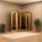Light wood corner infrared sauna with glass front doors and vertical wood slats inside, displayed in room setting with potted
