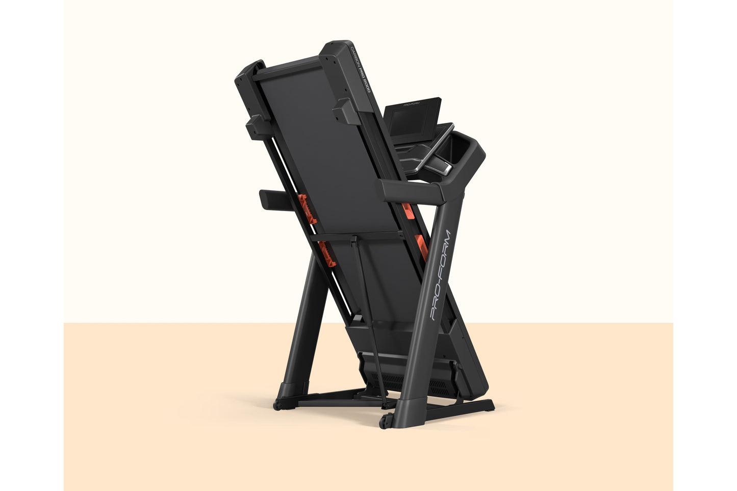Black ProForm Carbon Pro 2000 treadmill with digital display, red accents, and folding frame on beige background