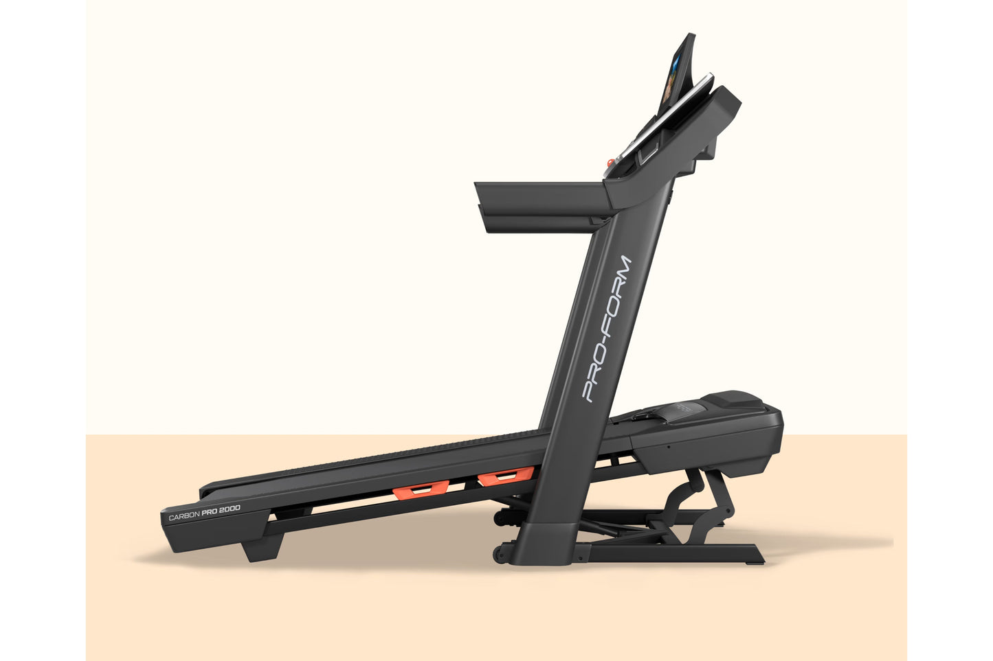 ProForm Carbon Pro 2000 black treadmill with digital display and orange accents, shown at angle on beige background