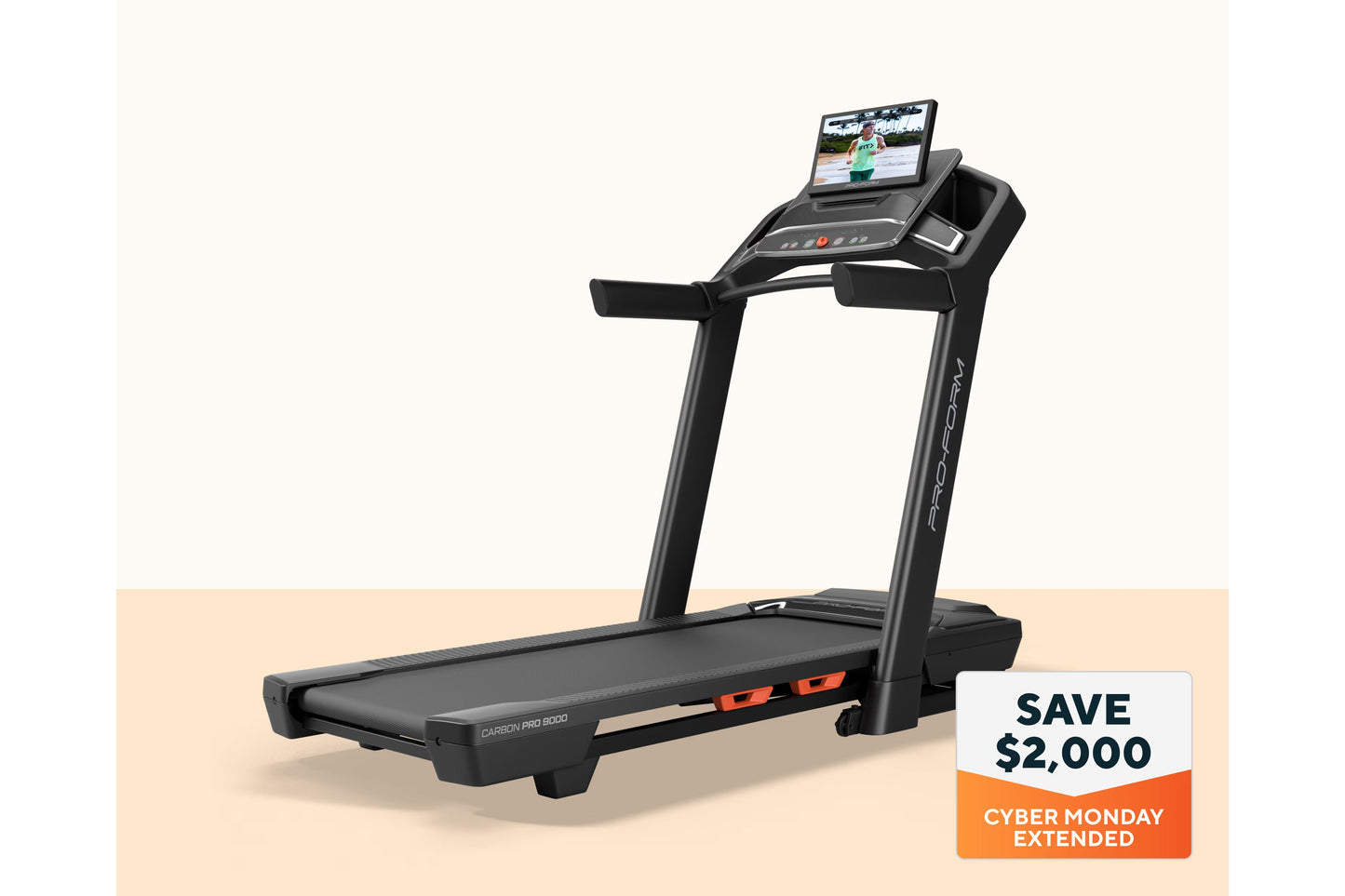 Black ProForm Carbon Pro 9000 treadmill with digital console displaying workout video, on beige background