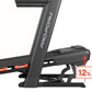 ProForm Carbon Pro 9000 treadmill with black frame, orange accents, and digital display showing 12% incline adjustment on whi
