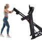 Woman in blue leggings and gray sports bra using black ProForm treadmill with digital display on white background