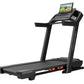Black ProForm Carbon Pro 9000 treadmill with touchscreen display showing fitness video, padded running deck, and orange accen