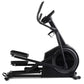 Black elliptical machine with curved handlebars and pedal base on white background