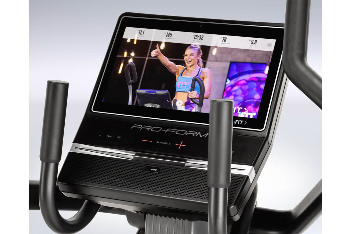 ProForm Pro HIIT H14 elliptical with black frame, dual handles, touchscreen display showing workout class, and performance me