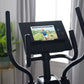 Black ProForm sport elliptical with digital display screen showing workout video, dual handlebar arms, and base positioned in