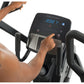 Person using black ProForm Trainer HL elliptical with digital display showing 202 time readout, worn by model on white backgr