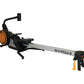 Ski-Row Air rowing machine with black frame, orange flywheel, digital monitor, and yellow foot stabilizer on white background