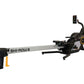 Shi-Row Air rowing machine with gray beam, black seat and frame, digital display monitor, and yellow accents on white backgro