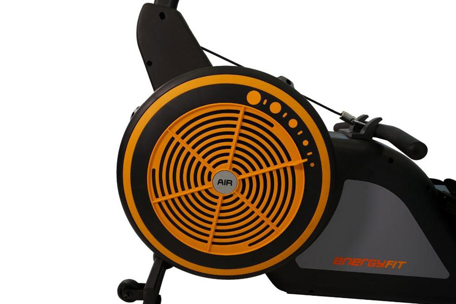 Black and orange AIR rowing machine with circular fan wheel design, displayed against white background