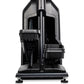Black upright elliptical machine with digital display and dual handles, front view on white background