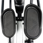 Black and silver elliptical machine with textured oval foot pedals and adjustable arms, overhead view on white background