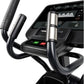 Black and silver elliptical machine with digital console displaying workout metrics, padded handles, and control buttons on w