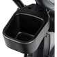 Black cup holder attachment mounted on elliptical machine handlebar