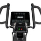 Spirit CE850 stationary elliptical with black frame, padded handles, digital console displaying fitness metrics, and green st