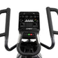 Spirit CE900 stationary bike with black padded handlebars, digital display showing workout metrics, and control buttons on wh