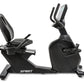 Spirit CR1000ENT black recumbent exercise bike with seat back, handlebars, and tablet holder on white background