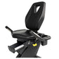Black recumbent exercise bike with padded seat, backrest with handle cutout, armrests with cup holders, and foot pedals on wh