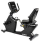 Spirit CR900 recumbent exercise bike with black frame, digital console display, and cushioned seat on white background