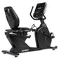 Spirit CR900 black recumbent exercise bike with digital console, padded seat, and foot pedals on white background