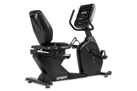Spirit CR900 black recumbent exercise bike with digital console, padded seat, and foot pedals on white background