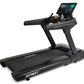 Spirit CT1000ENT black treadmill with digital touchscreen console, handrails, and running belt on white background