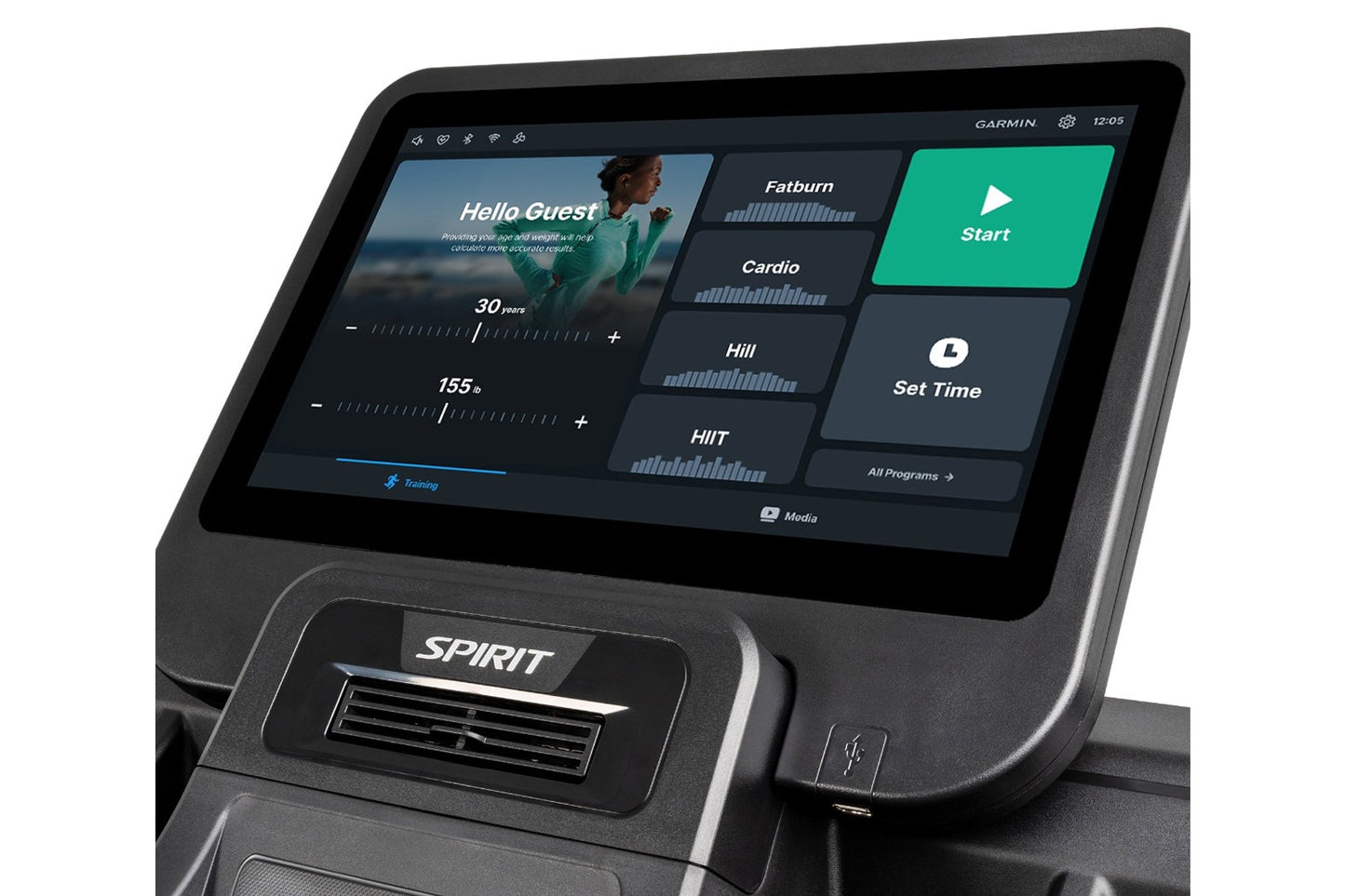 Spirit CT800ENT treadmill with black frame and touchscreen display showing Garmin fitness app with workout programs including