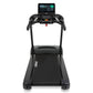 Black Spirit treadmill with touchscreen display console, black handles, and running belt on white background, front view