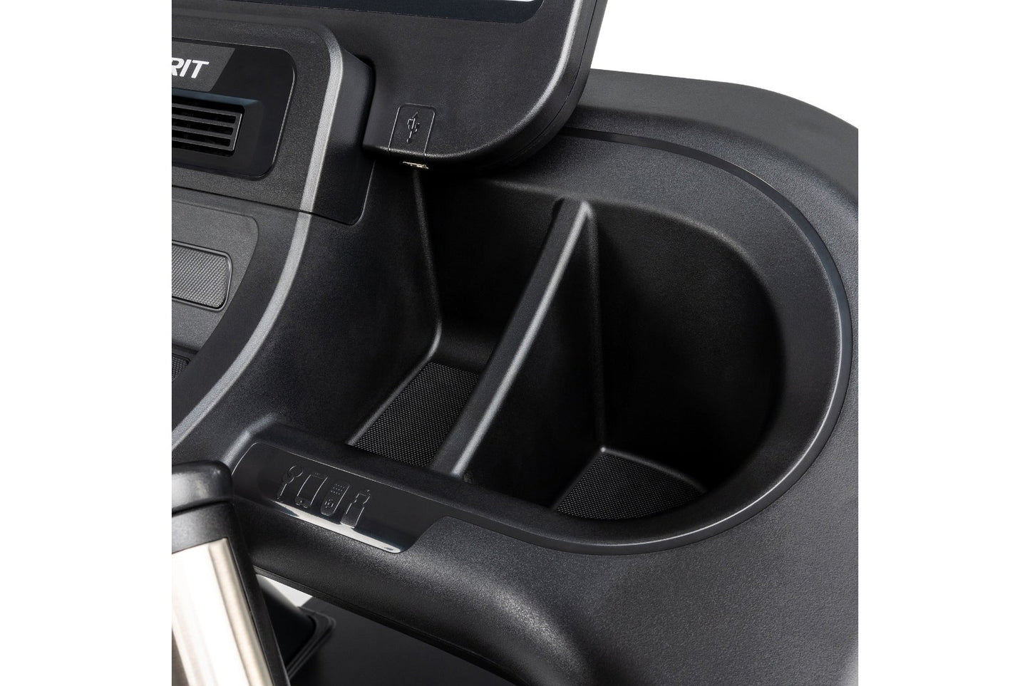Black plastic cup holder and storage compartment on treadmill console, close-up detail view